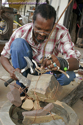 Holley working on�one of his�wire�yard art sculptures.